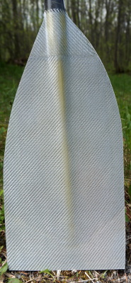Asymmetric paddle blade